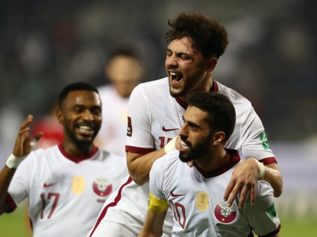 Hassan Al Haydos of Qatar celebrates his first goal with his teammates on June 7, 2021